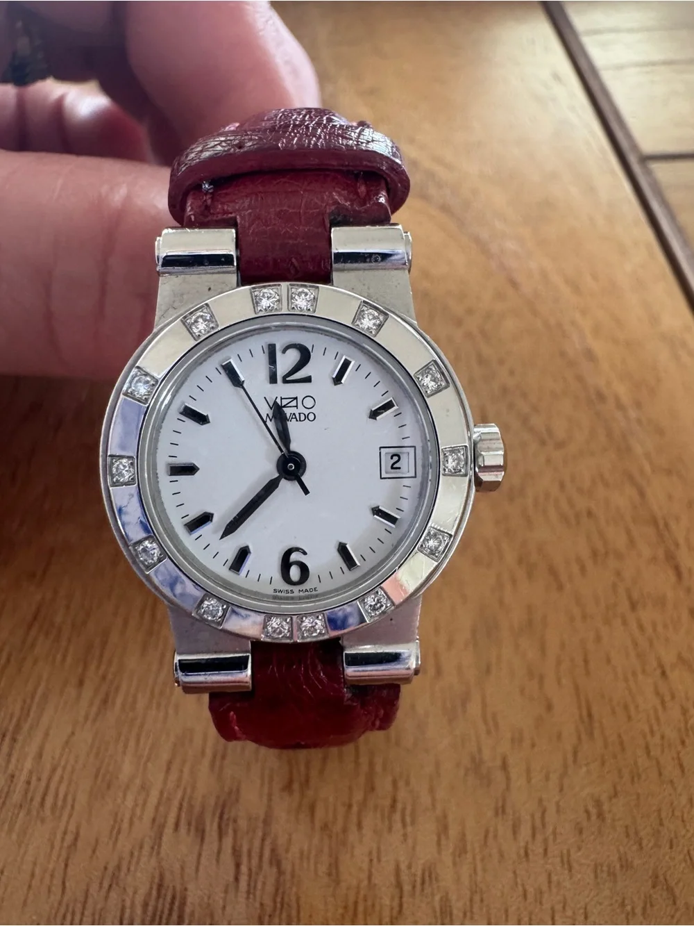 VZO Movado Ladies Watch w/ Diamond Bezel. Red leather strap. Pristine condition.